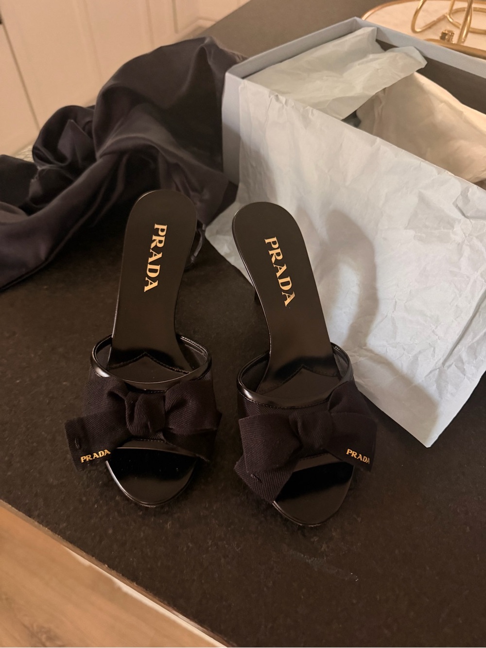 Prada Black Bow Slide Mules with Gold Logo